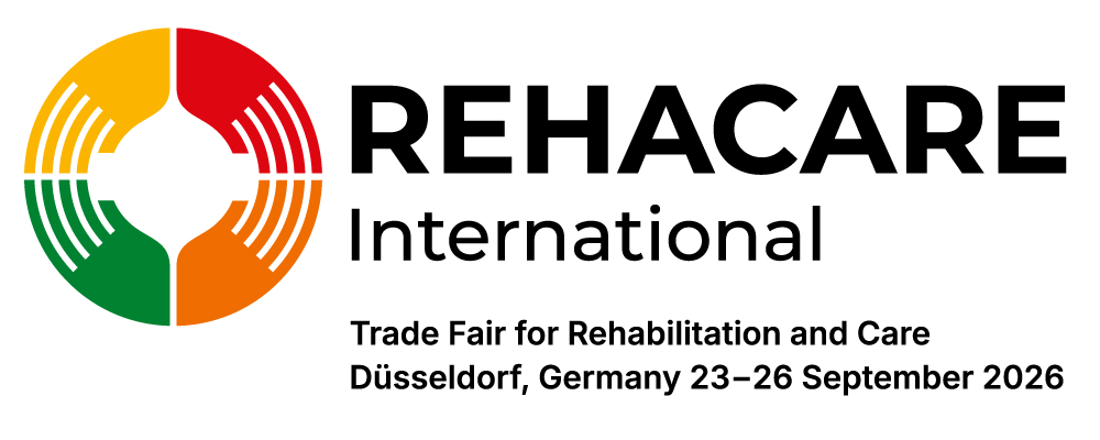 logotyp Rehacare International: cztery dłonie w kolorach żółtym, czerwonym, pomarańczowym i zielonym, które tworzą razem okrąg. Pod spodem napis: Rehacare International Trade Fair for Rehabilitation and Care Düsseldorf, Germany, 23-26 September 2026.